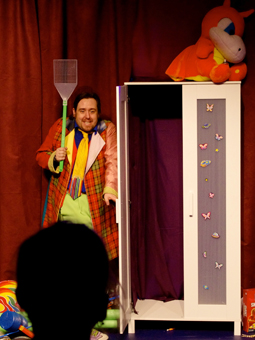 Matt hides waiting for Kat with a massive fly swatter